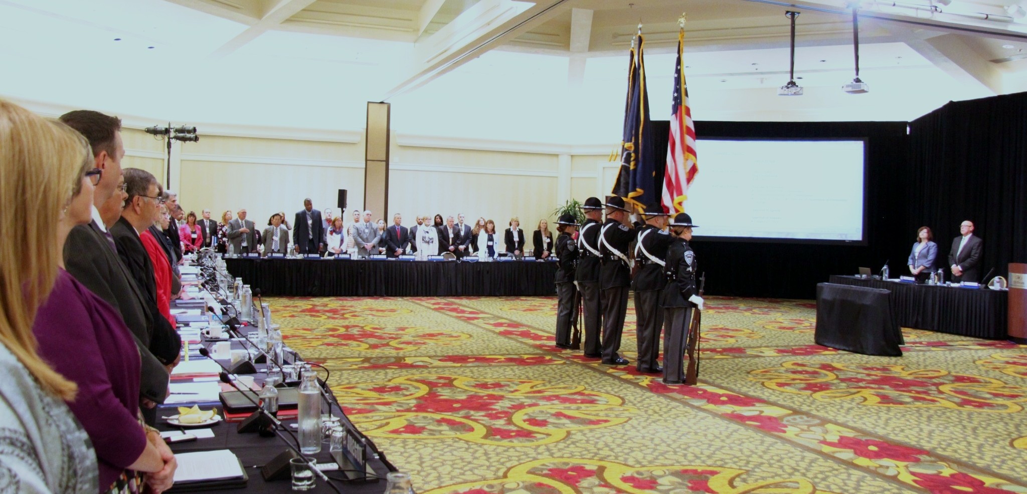 conference photo with flags