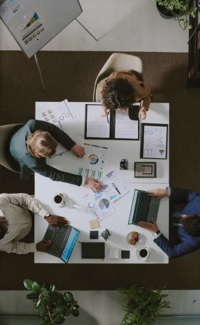 Birds eye view looking down at a group of people working at a table